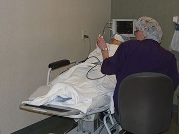 Doctor caring for a patient in bed