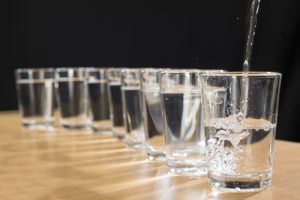 Water being poured into glasses