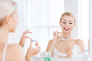 Woman using contact lenses