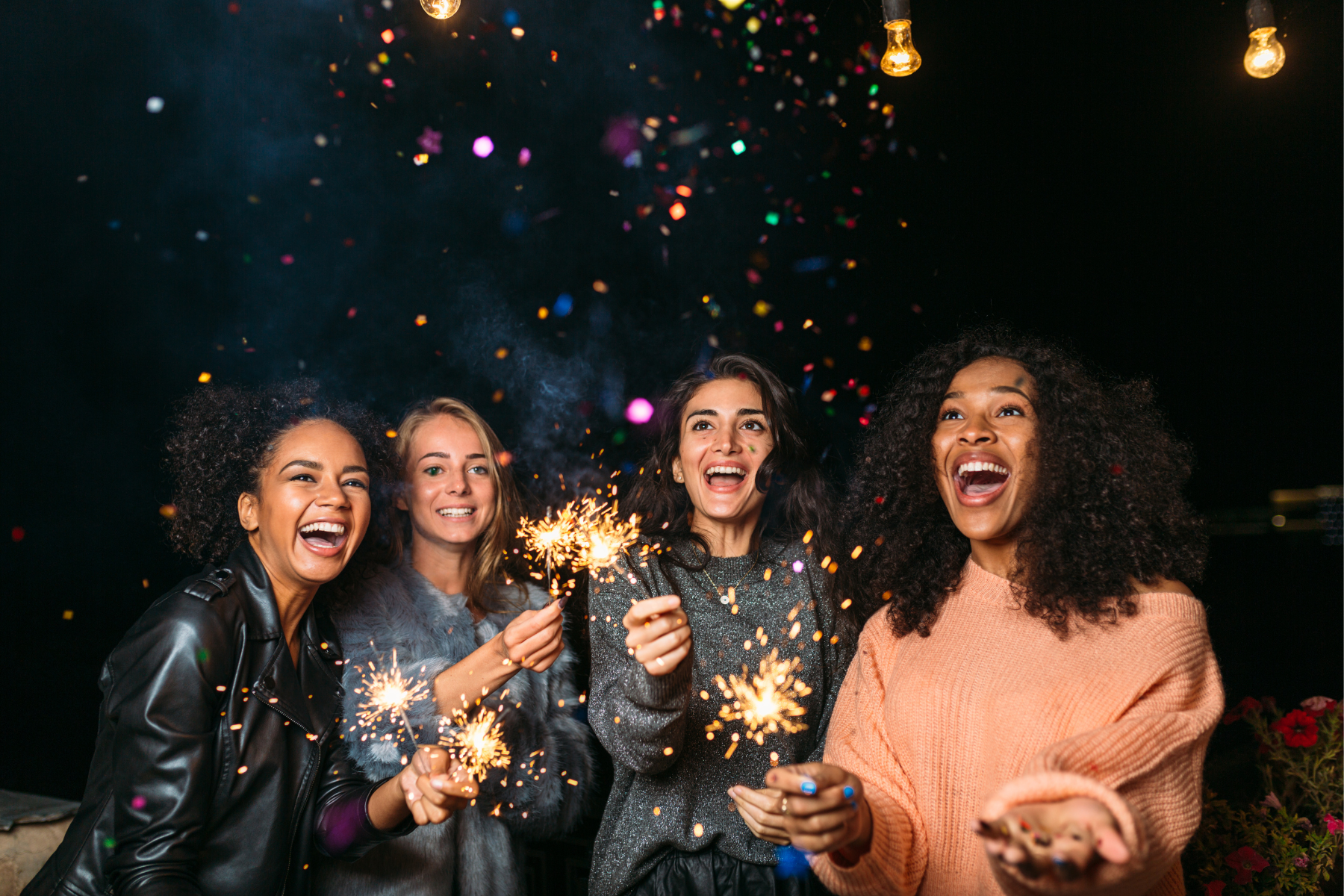 Friends holding sparklers